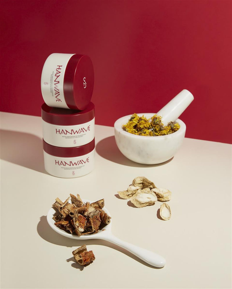 HANWHA products with a bowl of dried herbs on a red background